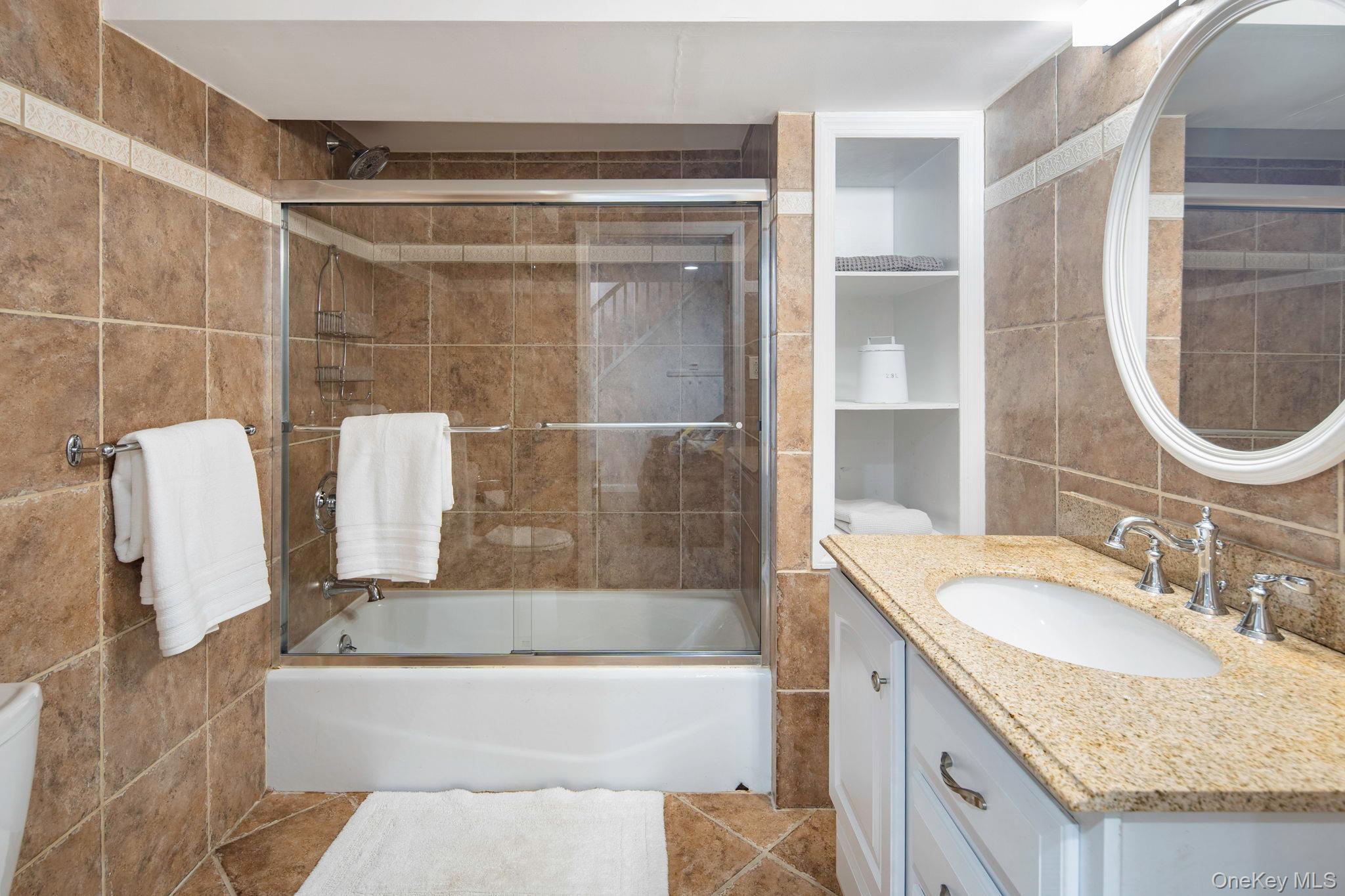 36 Pond Hill Road Chappaqua, NY 10514 - Photo 24 of 32 a bathroom with a granite countertop sink and a mirror