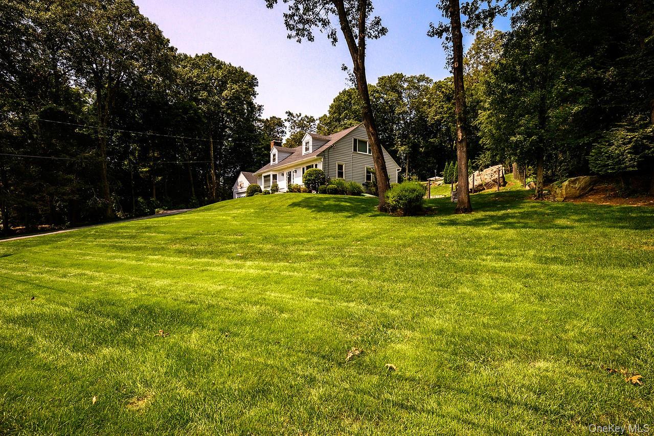 36 Pond Hill Road Chappaqua, NY 10514 - Photo 25 of 32 a view of a house with a yard and tree s
