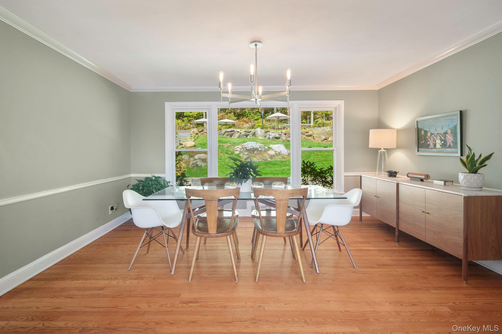 36 Pond Hill Road Chappaqua, NY 10514 - Photo 10 of 32 a dining room with furniture a chandelier and wooden floor