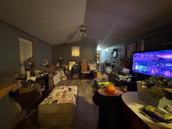 a living room with lots of furniture and a flat screen tv