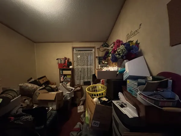 a room with furniture and gym equipment
