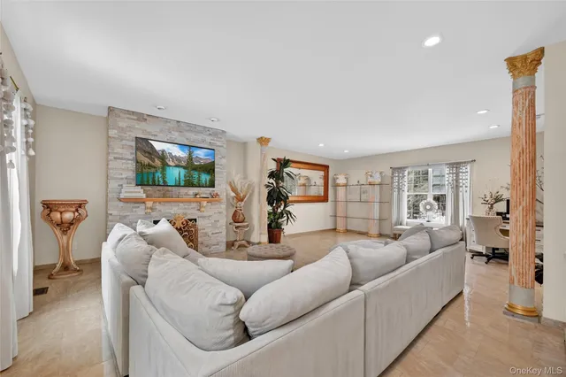 a living room with furniture and a flat screen tv