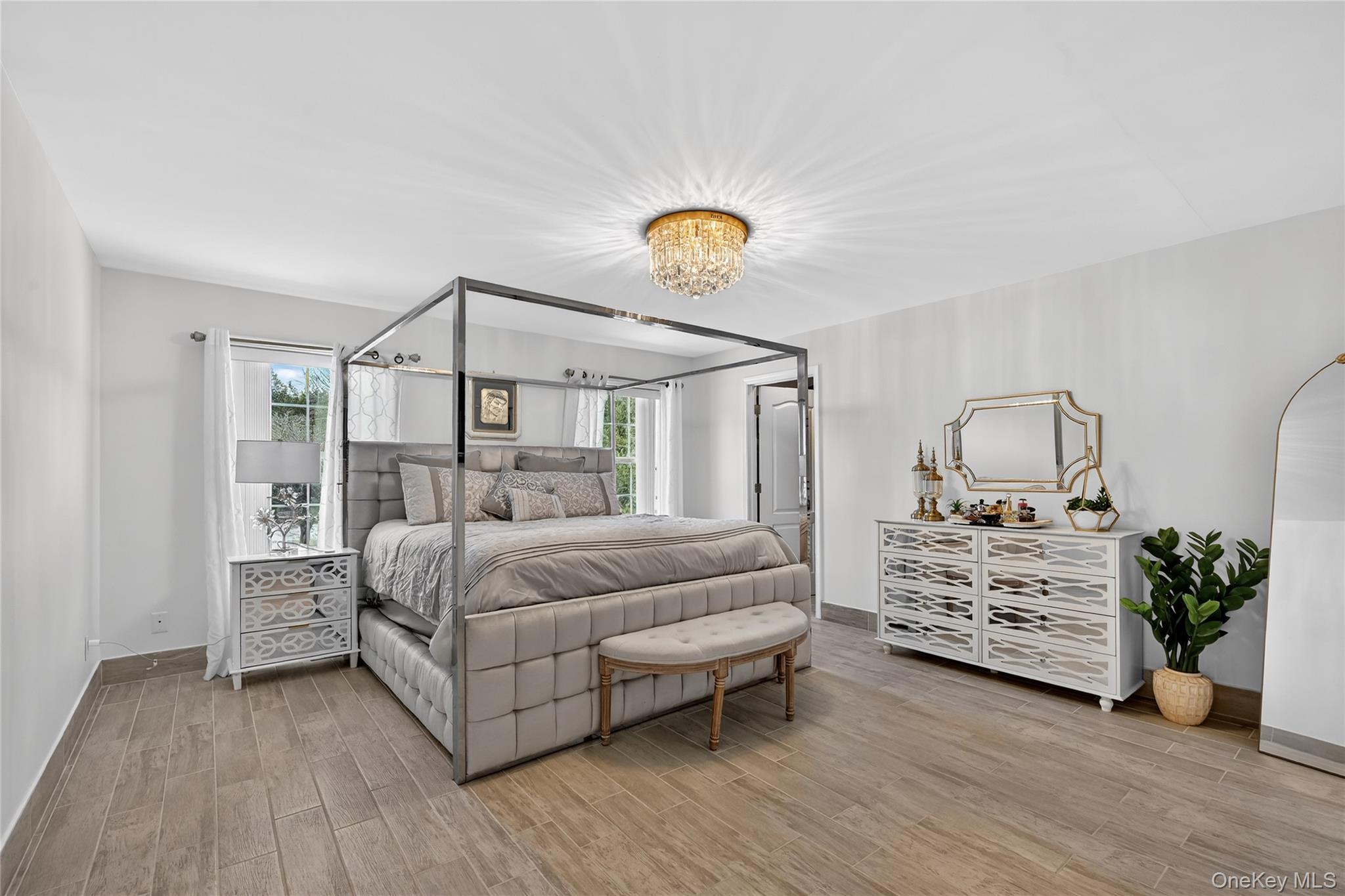 16 Kukas Road Monticello, NY 12701 - Photo 29 of 50 a bedroom with a bed and wooden floor