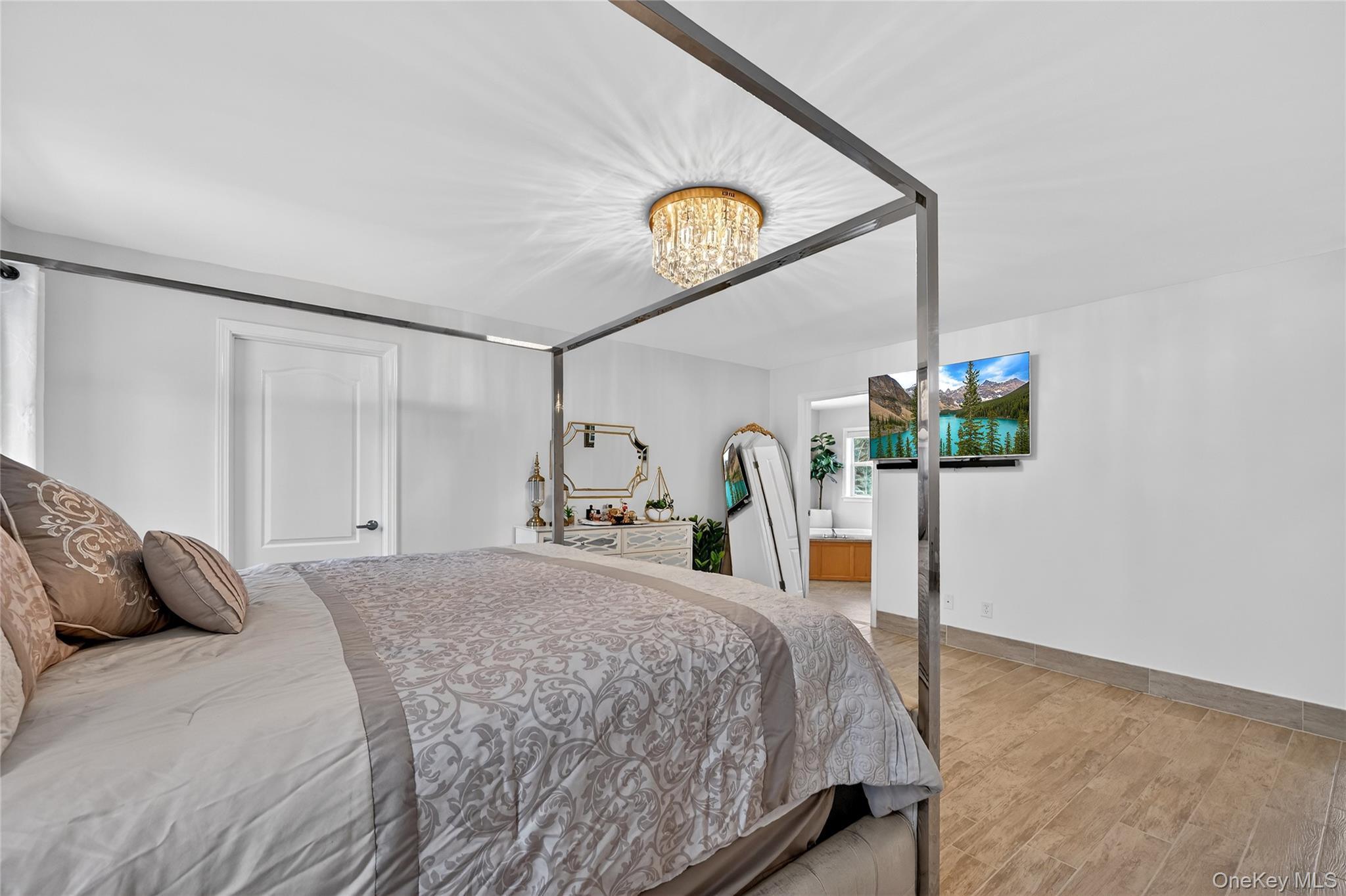 16 Kukas Road Monticello, NY 12701 - Photo 30 of 50 a bedroom with a bed and a large mirror on the dresser