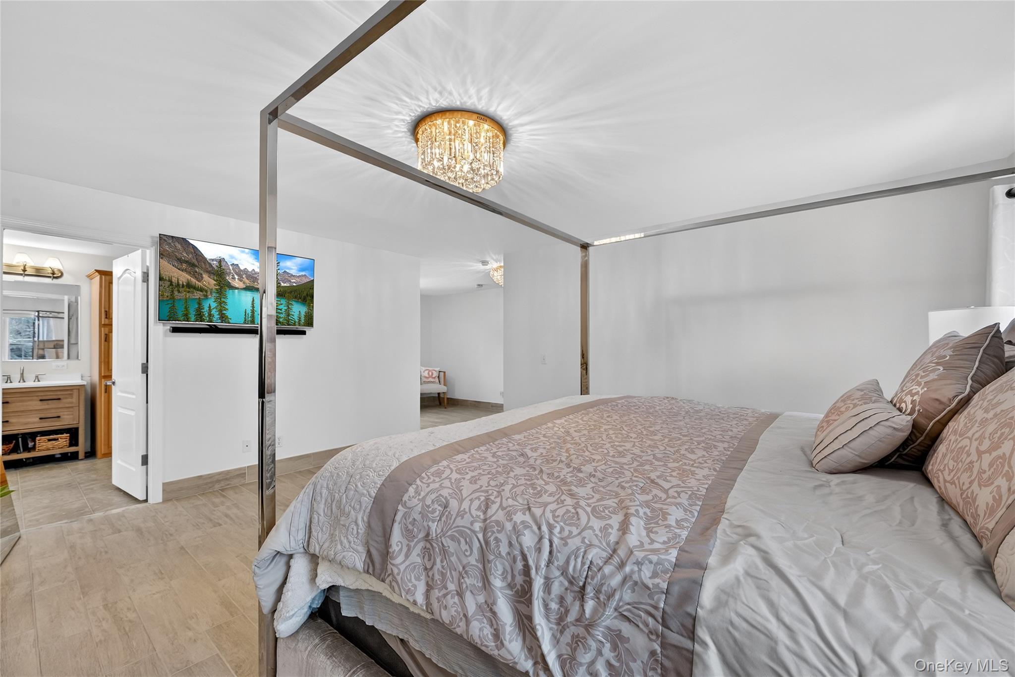 16 Kukas Road Monticello, NY 12701 - Photo 31 of 50 a bedroom with a bed and a potted plant