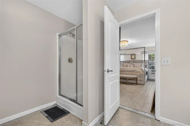 a view of bedroom with furniture and closet