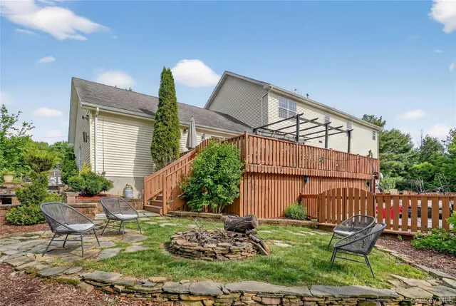 a view of a chair and table in backyard