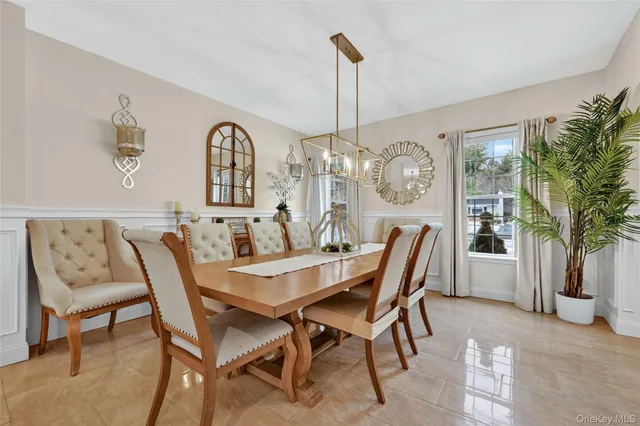 a view of a dining room with furniture window and flowerpot