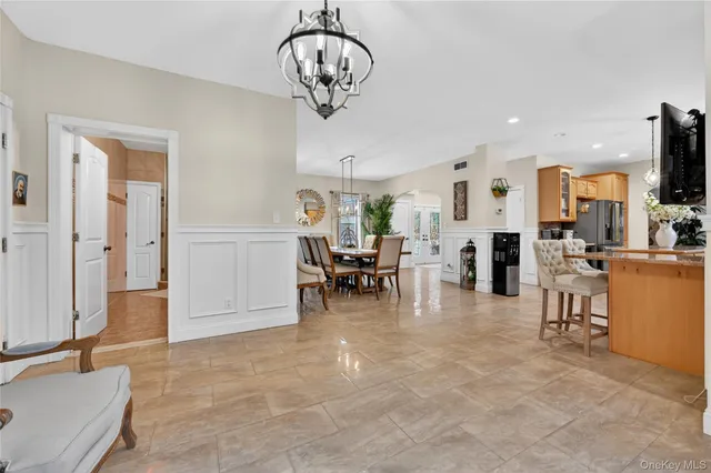 a view of a livingroom with kitchen and furniture