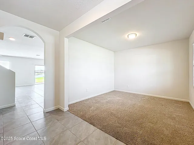 an empty room with a bathroom