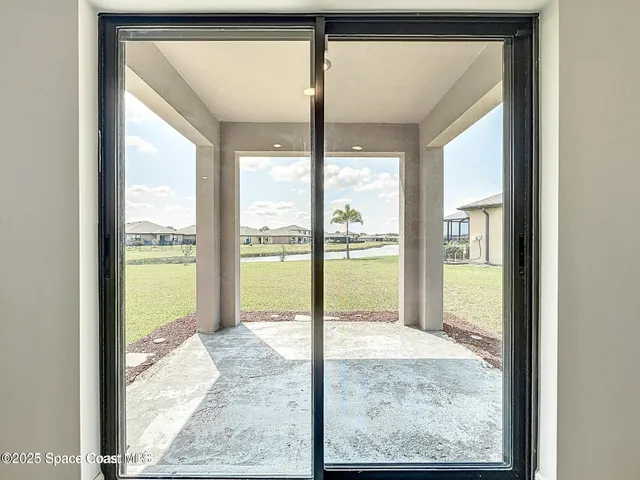 a view of a room that has a large window