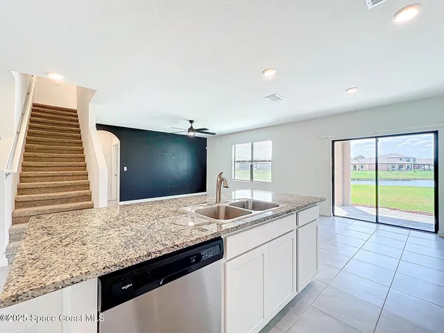 a kitchen with sink and window