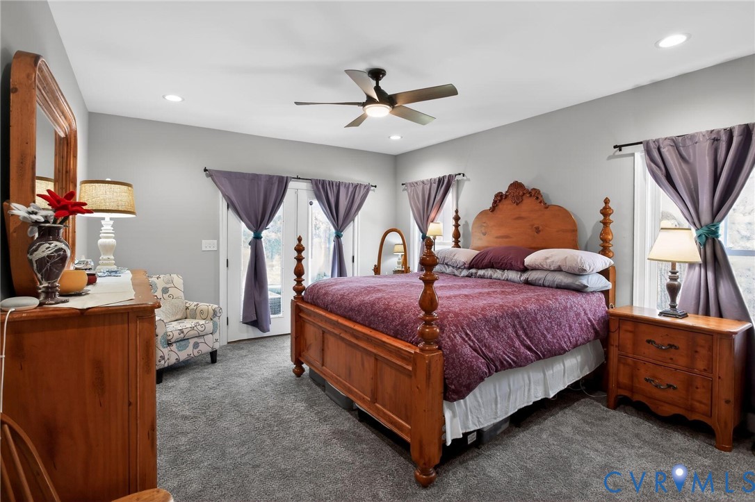 4 Walters Lane Poquoson, VA 23662 - Photo 16 of 35 a bedroom with a bed and a chandelier