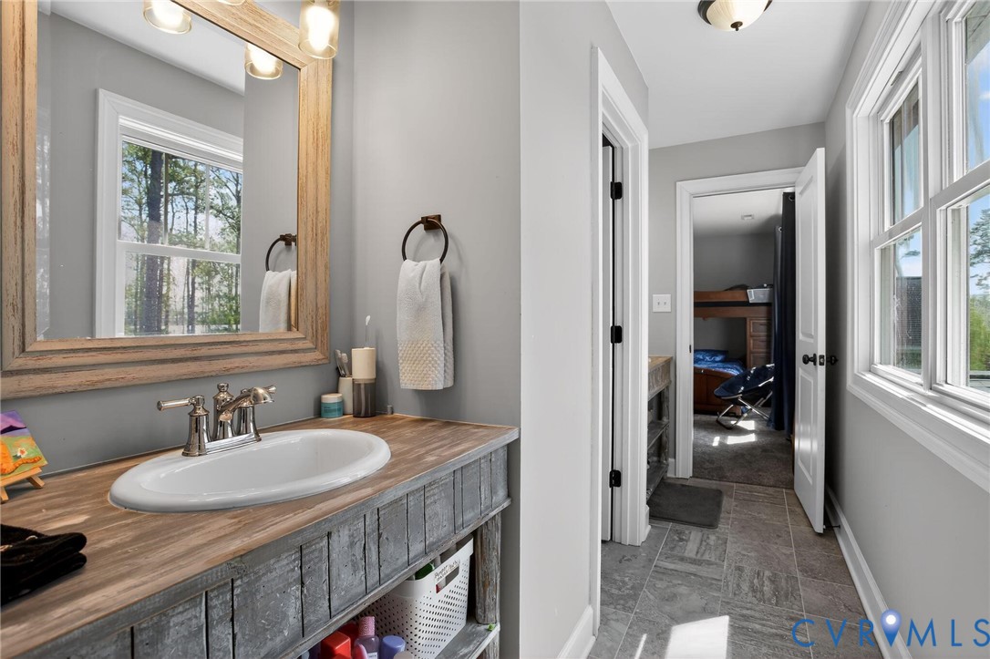 4 Walters Lane Poquoson, VA 23662 - Photo 23 of 35 a bath room with sink and a mirror