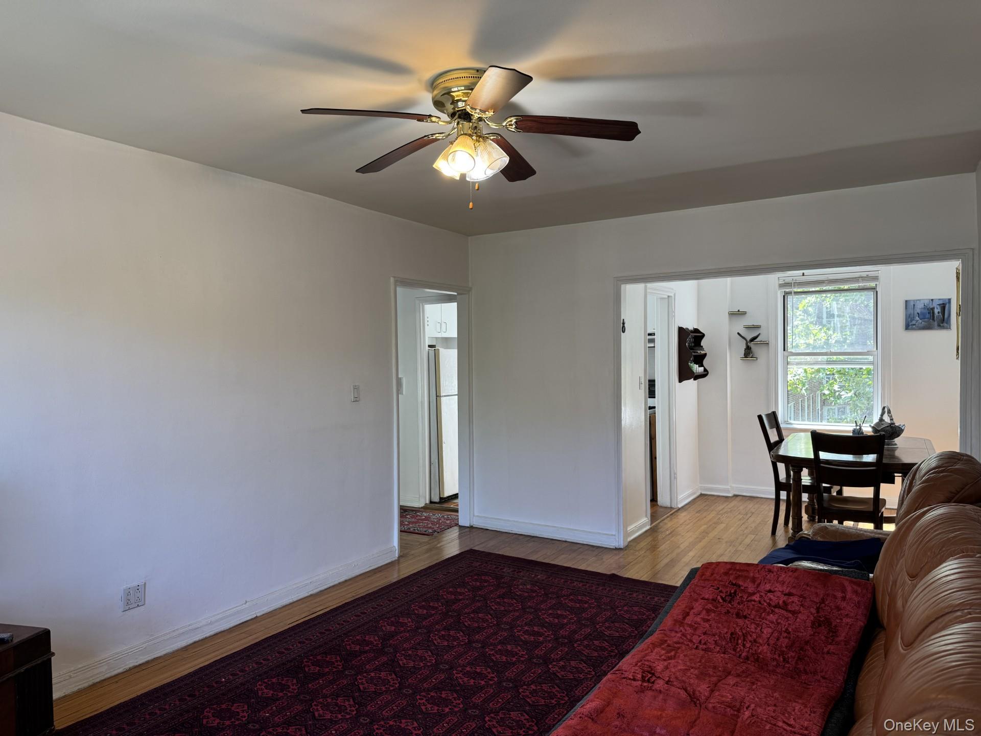 141-24 78th Road, Unit 3A Queens, NY 11367 - Photo 2 of 18 a living room with furniture and a window