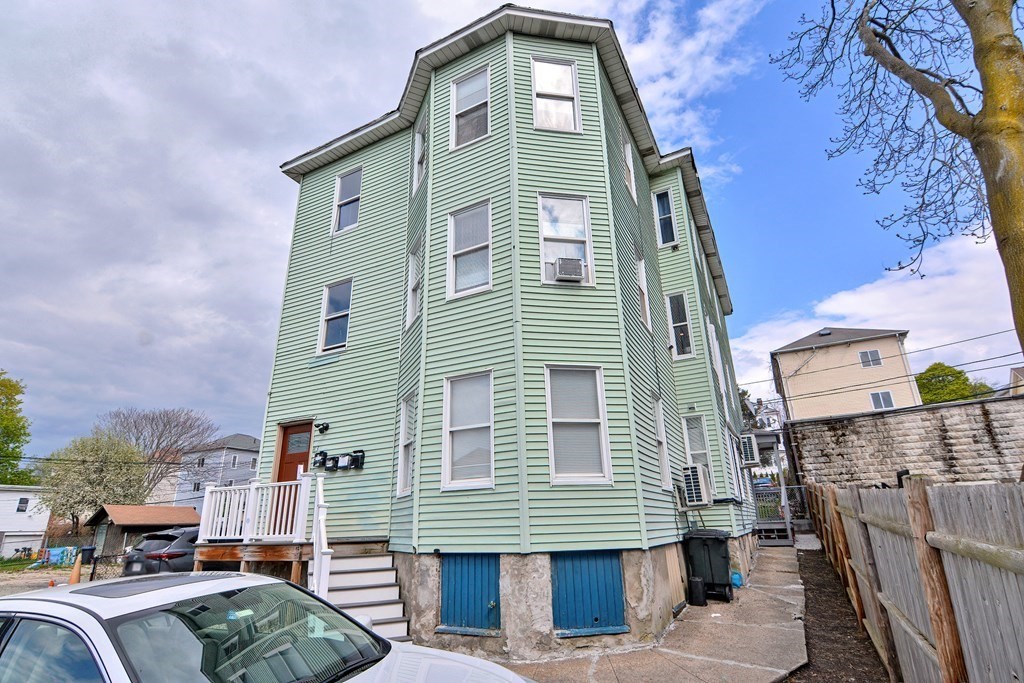 83 Ward Street Worcester, MA 01610 - Photo 1 of 28 a front view of a house with balcony
