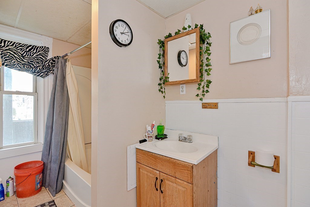 83 Ward Street Worcester, MA 01610 - Photo 21 of 28 a utility room with a window dryer and washer