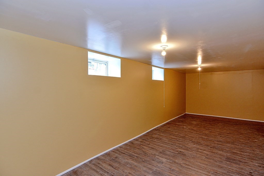 83 Ward Street Worcester, MA 01610 - Photo 22 of 28 a view of empty room with wooden floor
