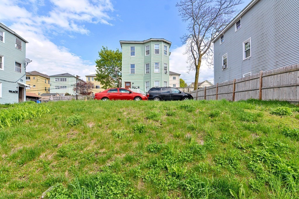 83 Ward Street Worcester, MA 01610 - Photo 3 of 28 a view of a house with a yard and sitting area
