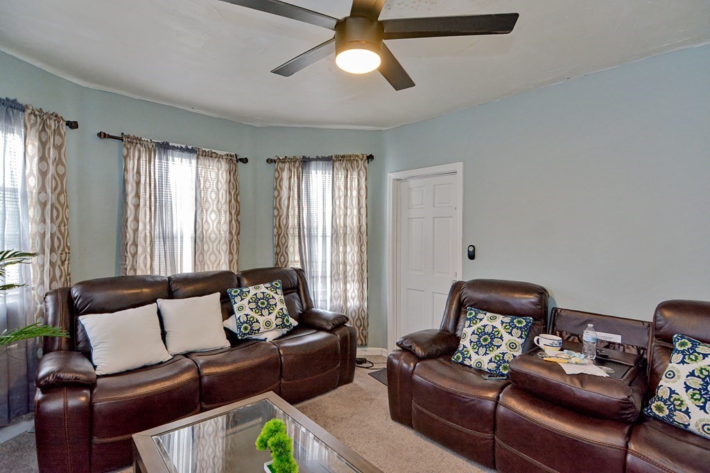 83 Ward Street Worcester, MA 01610 - Photo 4 of 28 a living room with furniture and a lamp