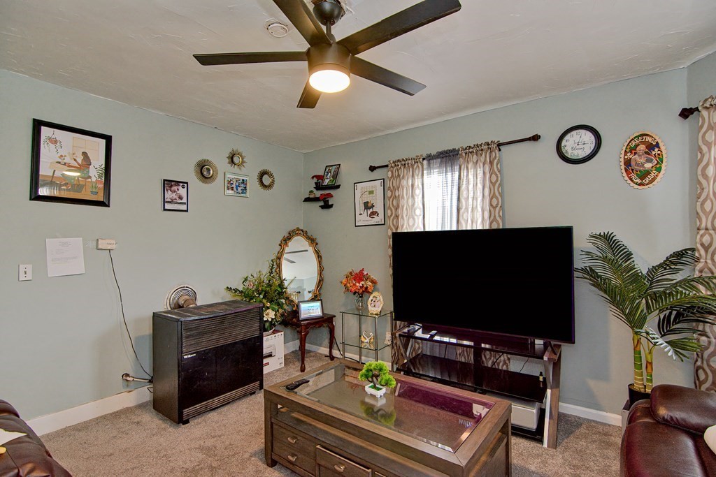 83 Ward Street Worcester, MA 01610 - Photo 5 of 28 a living room with furniture and a flat screen tv