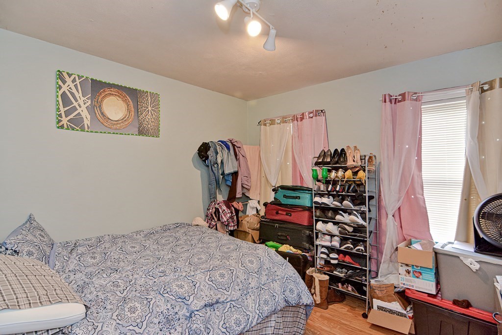 83 Ward Street Worcester, MA 01610 - Photo 8 of 28 a bedroom with bed and a closet