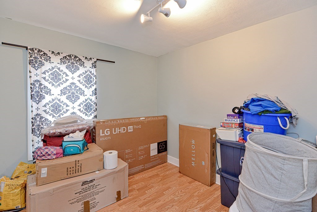 83 Ward Street Worcester, MA 01610 - Photo 10 of 28 a living room with furniture and a window