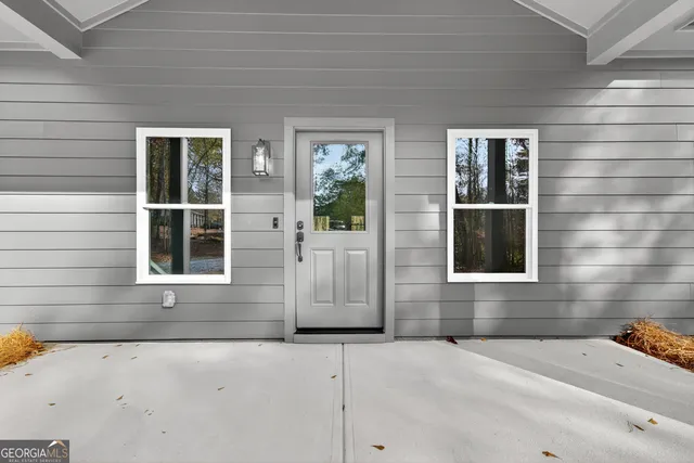 a front view of a house with a garage