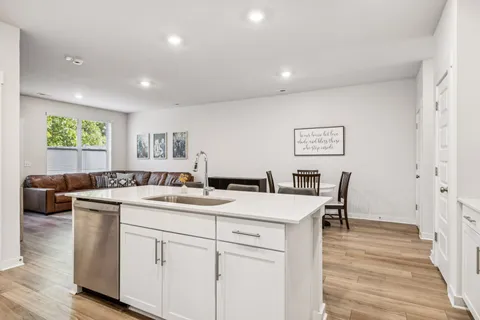 a view of a room with a table and chairs