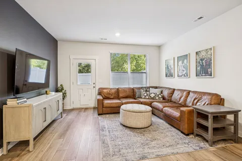 a living room with furniture and a large window