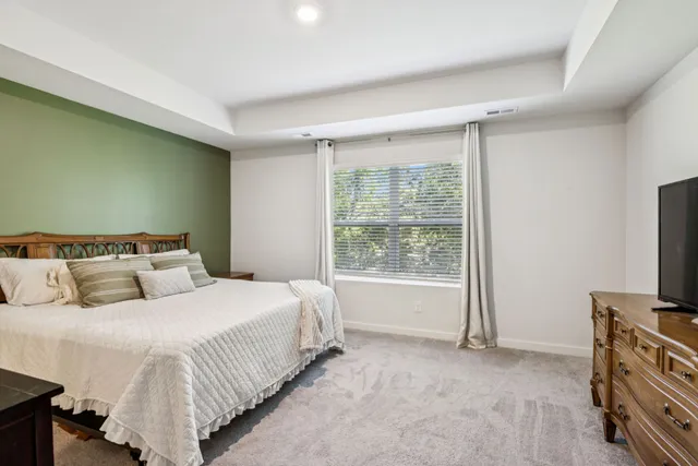 a bedroom with a bed and a cabinets