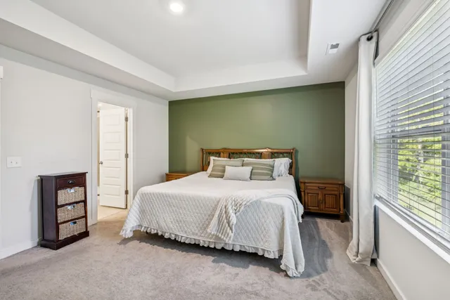 a bedroom with a bed and a television