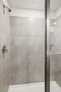 a view of walk in closet with clothes