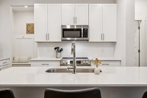 a kitchen with a sink and a microwave