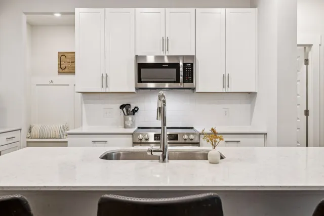 a kitchen with a sink and a microwave