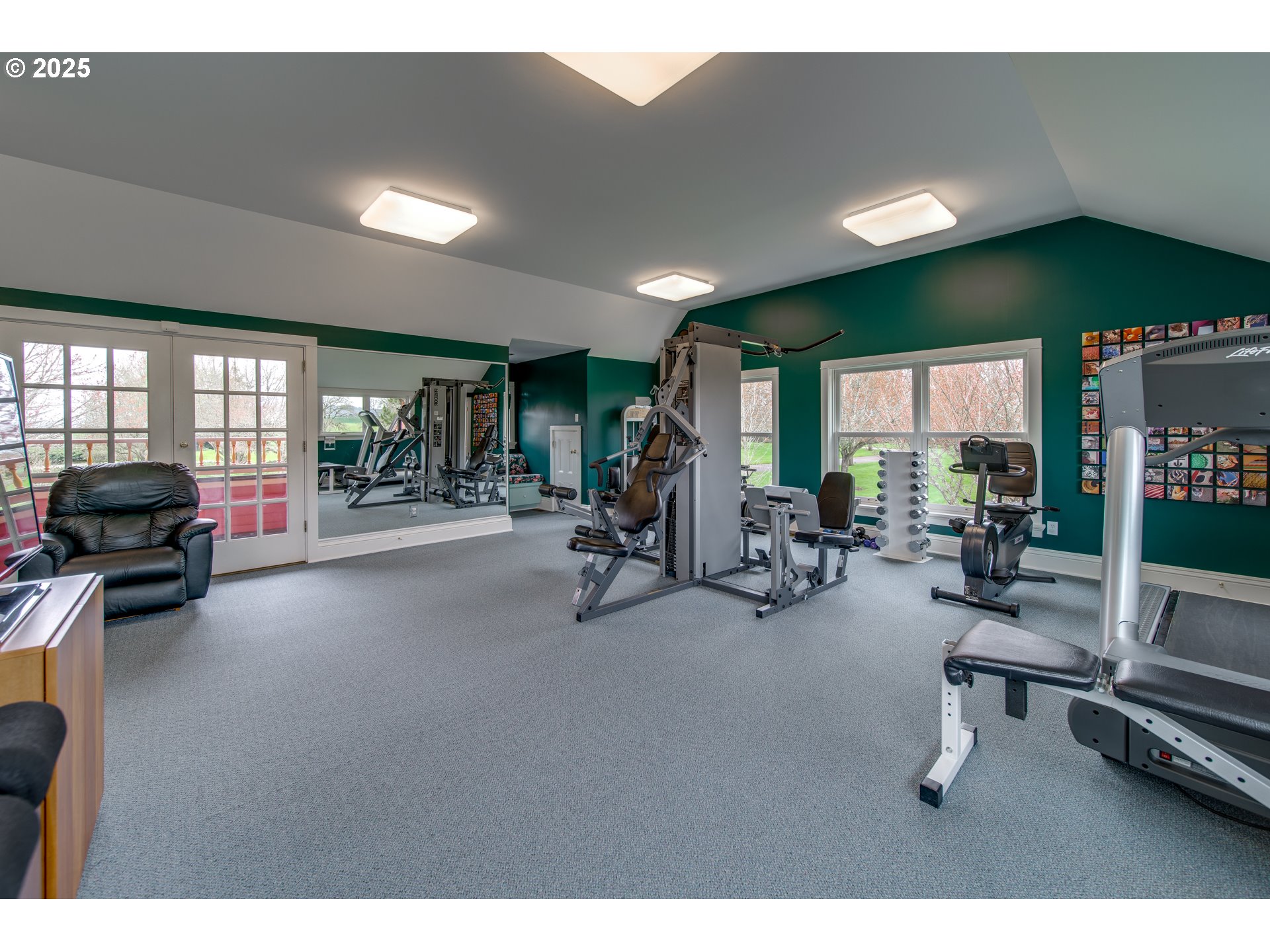11120 McCann Road Amity, OR 97101 - Photo 31 of 48 a room with gym equipment and a large window