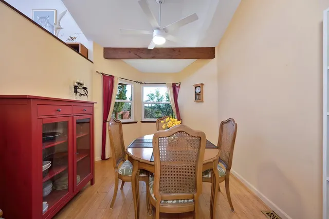 a view of a dining room with furniture window and wooden floor