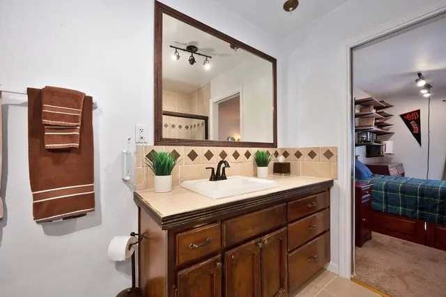 a bathroom with a sink and a mirror