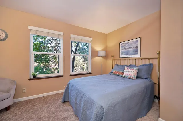 a bedroom with a bed and a couch