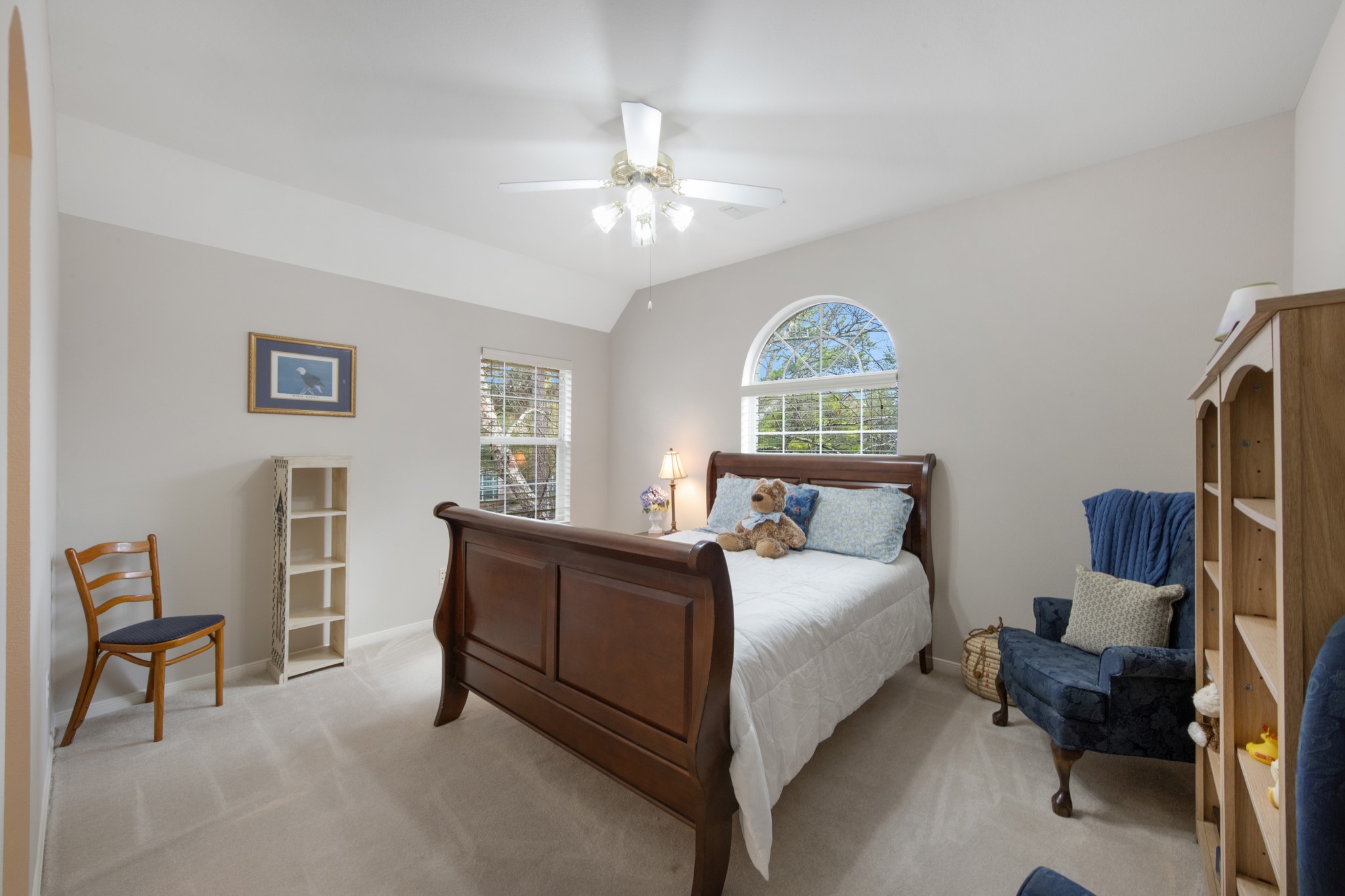 9510 Ashdown Forest Drive Spring, TX 77379 - Photo 31 of 50 BEDROOM 2 – bright secondary bedroom featuring vaulted ceilings and large windows that bring in natural light. A comfortable space for family members or guests.