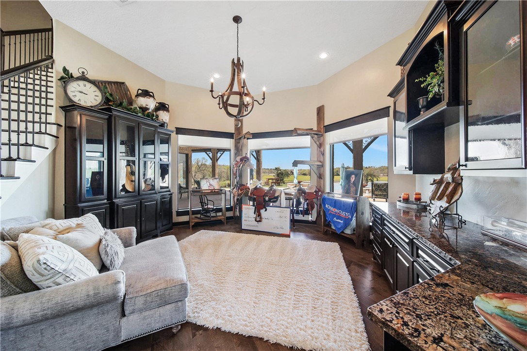 2289 Old Dobbin Road Montgomery, TX 77316 - Photo 12 of 50 a living room with furniture and a chandelier