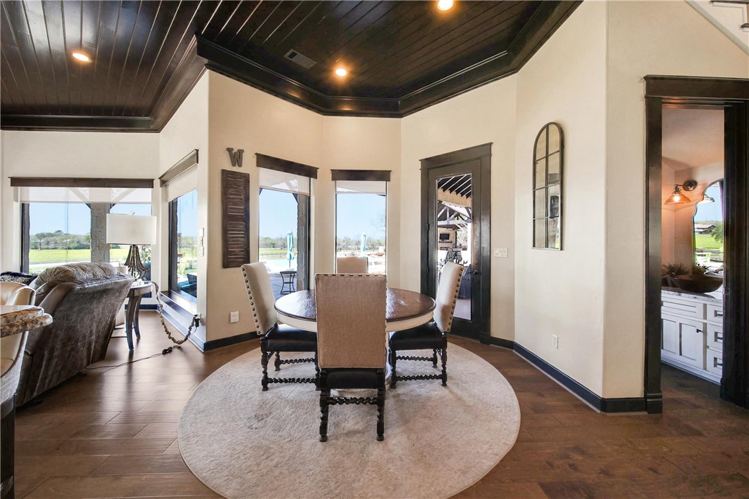 2289 Old Dobbin Road Montgomery, TX 77316 - Photo 17 of 50 a living room with furniture and a chandelier
