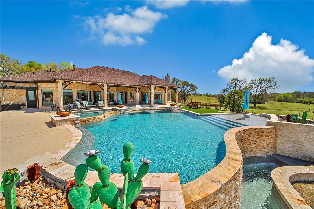2289 Old Dobbin Road Montgomery, TX 77316 - Photo 32 of 50 a view of a swimming pool with a patio