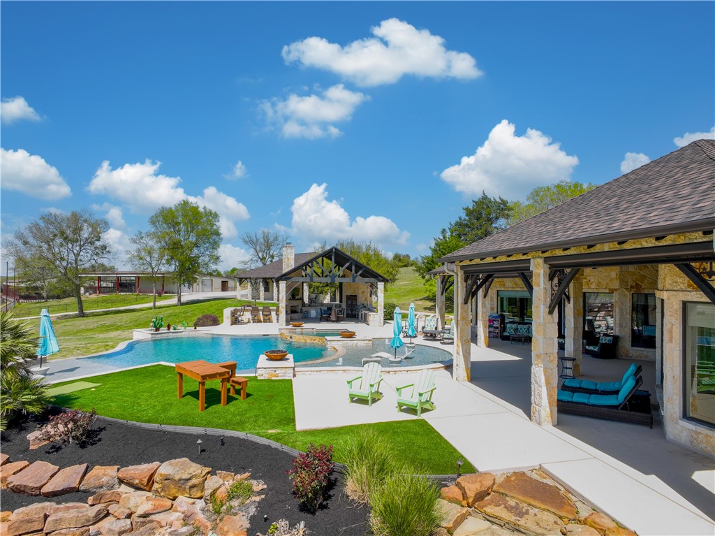 2289 Old Dobbin Road Montgomery, TX 77316 - Photo 33 of 50 a view of a swimming pool with a patio