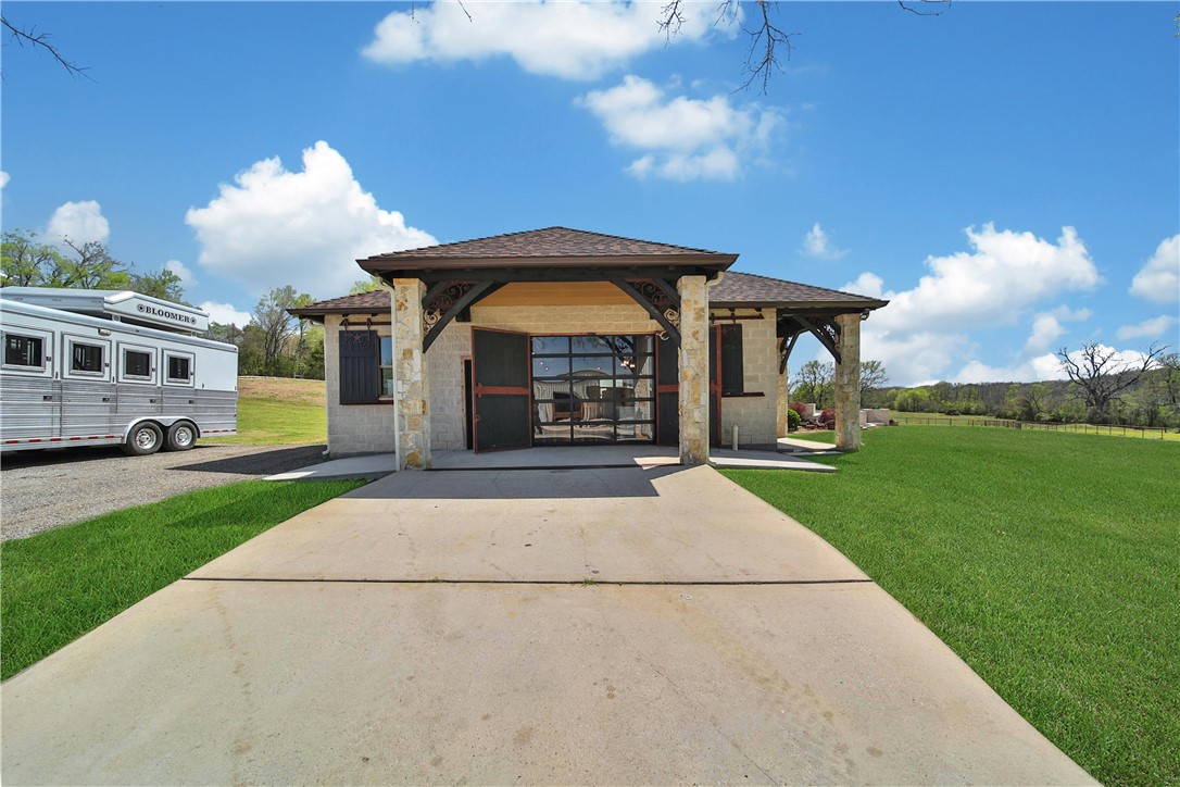 2289 Old Dobbin Road Montgomery, TX 77316 - Photo 34 of 50 a front view of a house with garden
