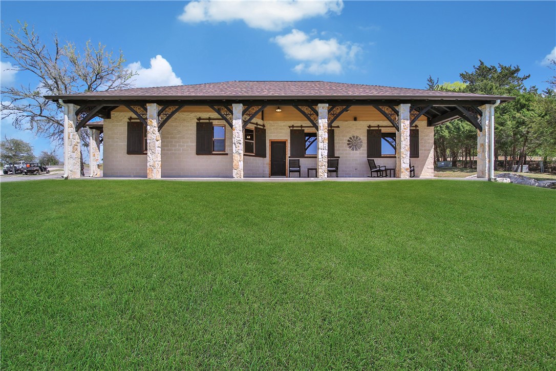 2289 Old Dobbin Road Montgomery, TX 77316 - Photo 35 of 50 a front view of house with yard and outdoor seating