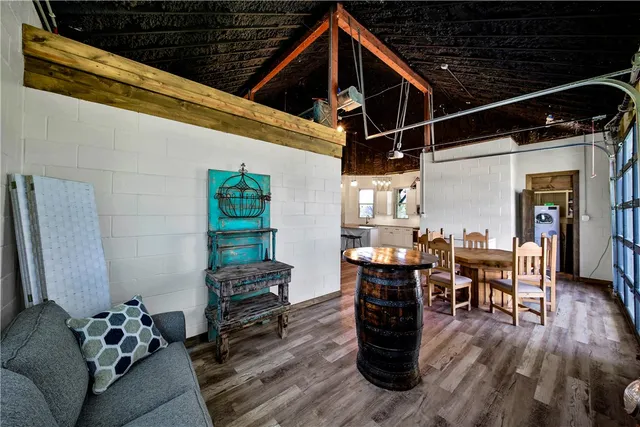 a bedroom with furniture and wooden floor