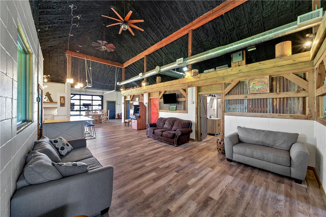 2289 Old Dobbin Road Montgomery, TX 77316 - Photo 38 of 50 a living room with furniture a fireplace and a chandelier