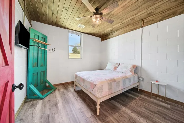 a view of walk in closet with clothes