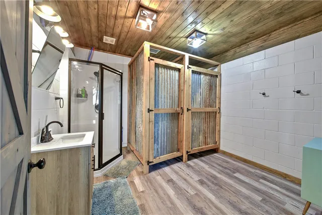 a view of a lake with houses in the back